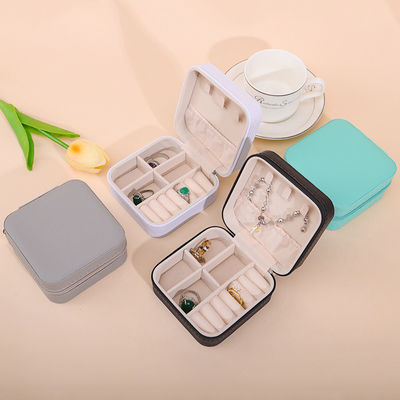 comprar Caja de joyería de cuero de PU de efecto flotante, caja de joyería de viaje con cremallera multifunción online manufacture