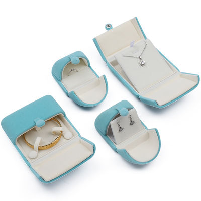 Caja de embalaje de joyas de terciopelo suave y elegante de color cian