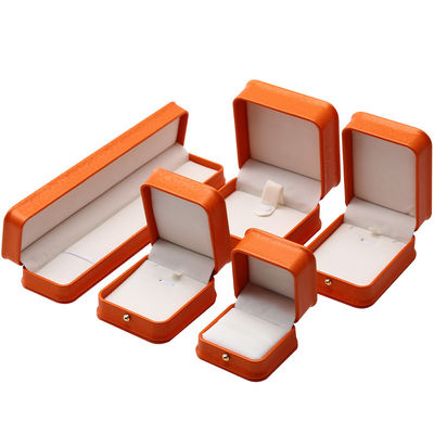 Caja de joyería de cuero PU de grano de nieve naranja noble para embalaje de almacenamiento de lujo