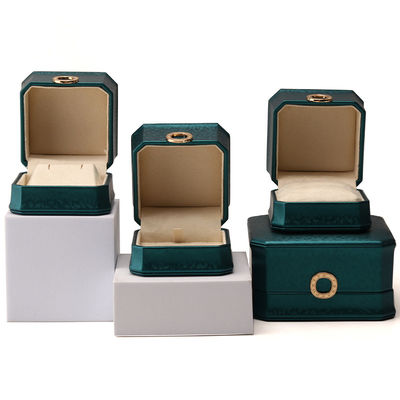 Caja de embalaje de joyas de cuero PU octogonal de color verde oscuro con ornamento de anillo
