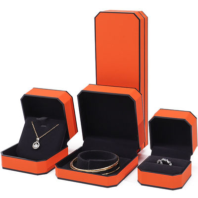 Caja de joyería de cuero PU con borde naranja negro octogonal para embalaje de lujo