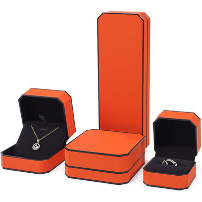 Caja de joyería de cuero PU con borde naranja negro octogonal para embalaje de lujo