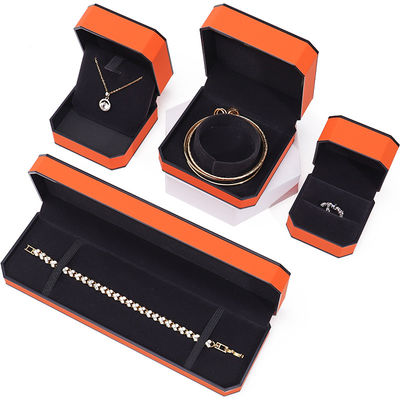 Caja de joyería de cuero PU con borde naranja negro octogonal para embalaje de lujo
