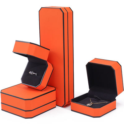 Caja de joyería de cuero PU con borde naranja negro octogonal para embalaje de lujo