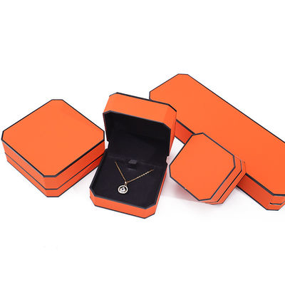 Caja de joyería de cuero PU con borde naranja negro octogonal para embalaje de lujo