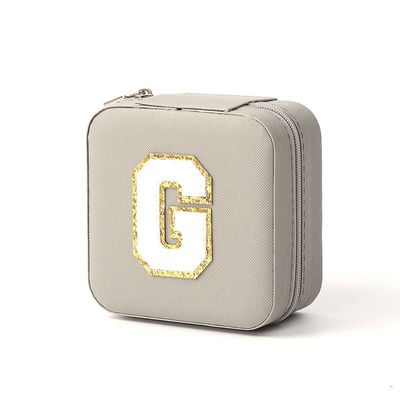 Pequeño organizador de joyas de cuero gris caja de almacenamiento de joyas de viaje