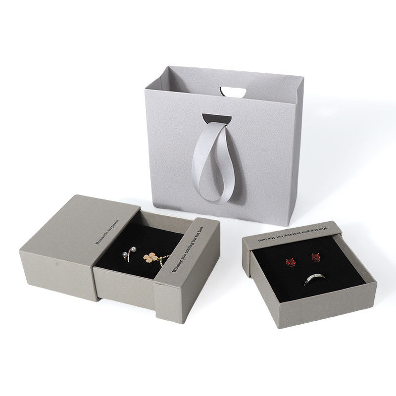 China fabricación al por mayor de alta calidad Caja de collar, pendientes, pulsera y anillo. Embalaje de joyería personalizado, ecológico, de cartón, papel gris, caja de joyería con cajón y logotipo.