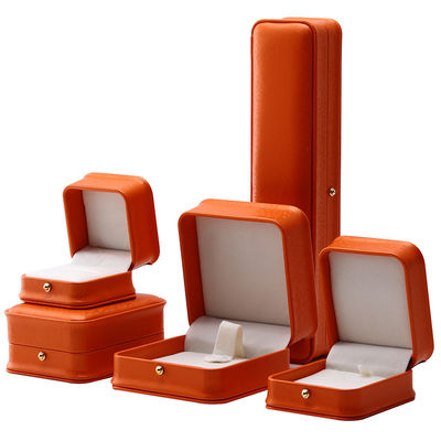 Caja de joyería de cuero PU de grano de nieve naranja noble para embalaje de almacenamiento de lujo
