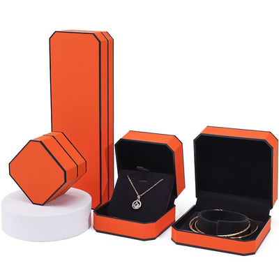Caja de joyería de cuero PU con borde naranja negro octogonal para embalaje de lujo